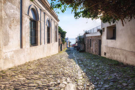 18th century street in Colonia del Sacramento (Uruguay - South America) on a sunny day. Calle de los suspiros.の写真素材