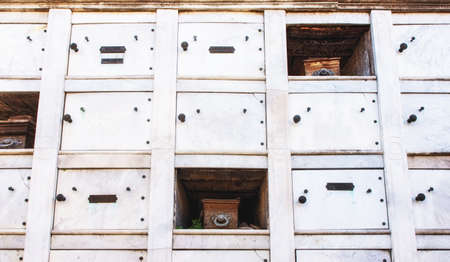 Large family mausoleum broken with old coffins showing in recoleta cemetery, Buenos Aires, Argentinaの写真素材