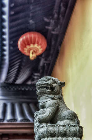 Lions outside of the Jade Buddha Temple in Shanghai, China. Lions often stand guard in front of significant buildings in China.の写真素材