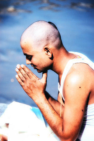 Kathmandu, Nepal - 11 October 2012: Nepalese Devotee offering religious puja along with butter lamps on the banks of the Bagmati Riverのeditorial素材