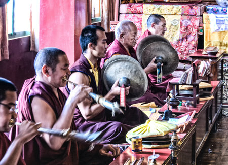 Kathmandu, Nepal - 10 October 2012: Unidentified  Buddhist monks play music during the praying in Bouddanath Stupa.のeditorial素材