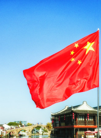 Zhujiajiao, China - November 15 Chinese flag at Shanghai Zhujiajiao Ancient water Town. Chinaのeditorial素材