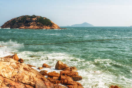 Rocky coast at Shek O Beach, on Hong Kong Island, Hong Kong.の写真素材