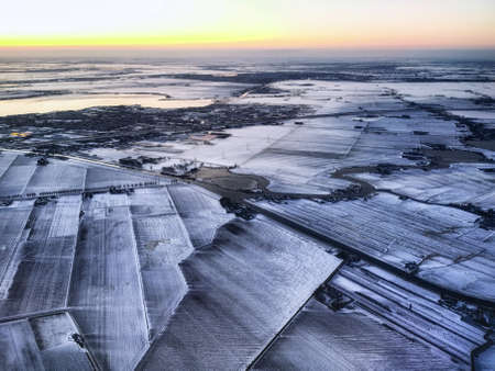 Rural landscape, Farmfield covered in snow, The Netherlands from above.の写真素材