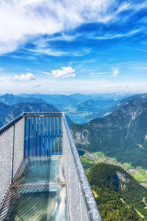 From the 5 Fingers, a steel construction on top of the Krippenstein Mountain at the Dachstein glacier massif, tourists and hikers can enjoy an unique and amazing view of the Salzkammergut region with it's beautiful lakes and mountains.の写真素材