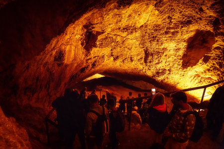 Obertraun, Austria - August 12, 2021 : Tourists during expedition in cave MammuthÃ¶hle, one of the largest karst caves in the world.at mountain Dachstein Upper Austria.のeditorial素材