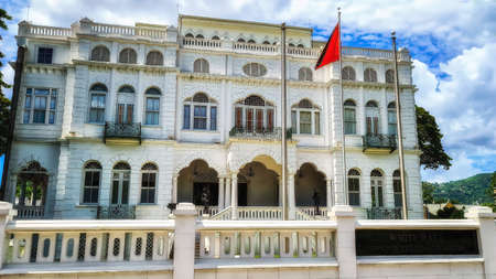 White Hall, office of the Prime Minister of Trinidad and Tobago, Port of Spain city, Caribbean. One of the Magnificent Seven, Whitehall, originally Rosenweg. National flag flying.の写真素材