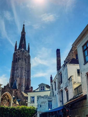 The Church of Our Lady (Onze-Lieve-Vrouwekerk) with tower at 115 metres (377 ft) in height, the tallest structure in the old town of Bruges (Brugge), Belgiumの写真素材