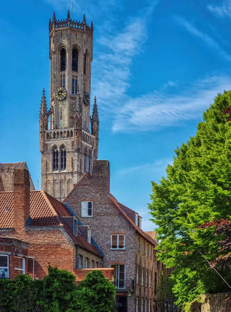 Bruges, Belgium. Cityscape with traditional houses and medieval bell tower Belfry in the city centre