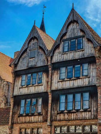 Exterior of medieval house on The Rozenhoedkaai (Quay of the Rosary). It is the hotel where 'In Bruges' was shot. Cityscape of Bruges streets shot from the boat.のeditorial素材