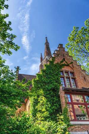 Afternoon view of the beautiful, medieval Church of Our Lady in Bruges, Belgiumのeditorial素材