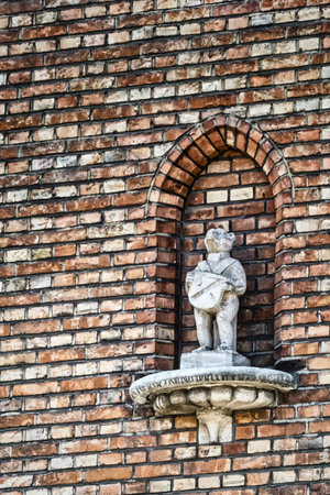 Bruges city symbol, the Brugs Beertje on the facade of the Poortersloge, Belgiumのeditorial素材