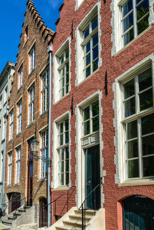 Traditional colorful Belgian facades of houses with tiled roofs in Bruges.のeditorial素材