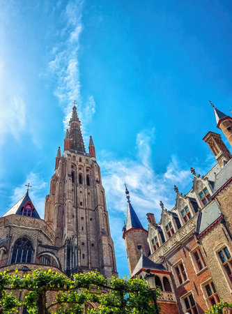 The Church of Our Lady (Onze-Lieve-Vrouwekerk) with tower at 115 metres (377 ft) in height, the tallest structure in the old town of Bruges (Brugge), Belgiumのeditorial素材