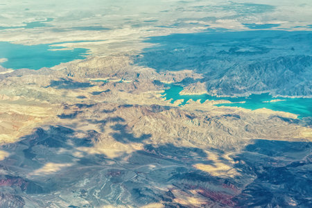 An aerial view shows a beautiful mountain landscape that rises from the desert surrounding Las Vegas, Nevada with landforms and Lake Meadのeditorial素材