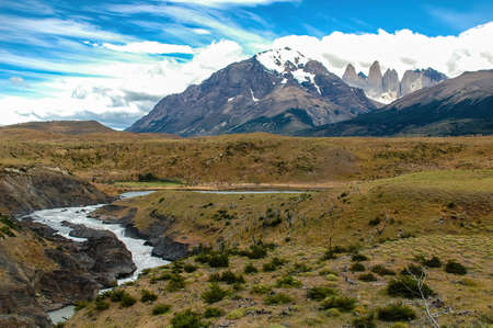 The peaks of Paine Grande, Cuernos and Torres del Paine with the turquoise glacier waters of the serrano river near Puerto Natales, Patagonia, Chile.の写真素材
