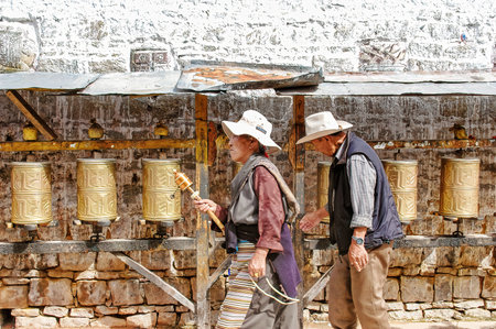 lhasa, Tibet - August 31 2007: Prayer wheels along a pilgrim route in Lhasa, Tibet (Potala Palace)のeditorial素材