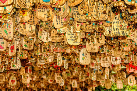 Lijiang, Yunnan - 25 August 2007: Hanging sign for pray at Lijiang Old Town in Lijiang Yunnan, Chinaのeditorial素材