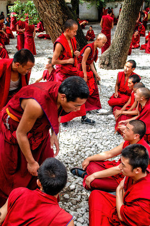 lhasa, Tibet - August 31 2007: Tibetan buddhist Monks dressed in traditional "uttarasanga" cloth..のeditorial素材