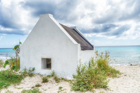 Former slave huts on the Caribbean island of Bonaire. These were built in 1850 to house slaves that worked on the salt mines.の写真素材