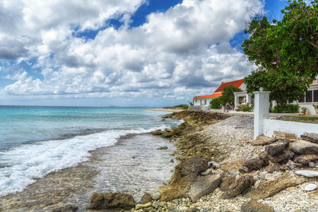 Scenic beach landscape with waterfront house, Bonaireの写真素材