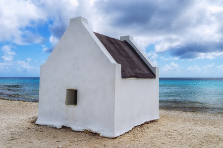 Former slave huts on the Caribbean island of Bonaire. These were built in 1850 to house slaves that worked on the salt mines.の写真素材