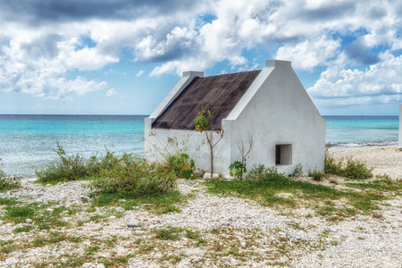 Former slave huts on the Caribbean island of Bonaire. These were built in 1850 to house slaves that worked on the salt mines.の写真素材