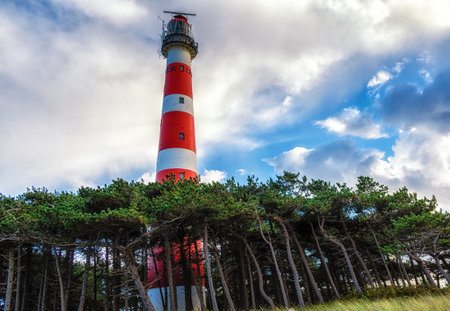 The red and white striped lighthouse of the Wadden island of Ameland in the north of the Netherlandsの写真素材