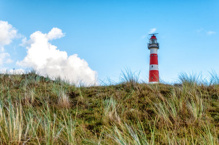 The beautiful lighthouse of Ameland (the Bornrif). Lighthouse Bornrif is an imposing sight on the island of Ameland, The Netherlandsの写真素材