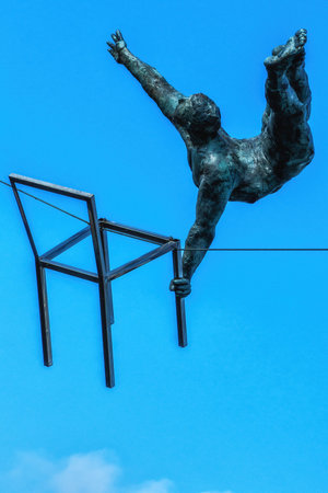 Krakow, Poland - 12 August 2022: view of acrobat iron sculptures on Bernatek pedestrian bridgeのeditorial素材