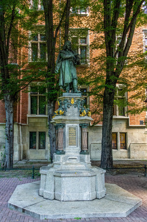 Krakow, Poland - 12 August 2022: Nicolaus Copernicus with astrolabe in hands statue in front of the Jagiellonian University building. Artist Cyprian Godebski, 1900.のeditorial素材