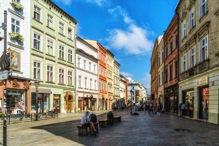 Krakow, Poland - 12 August 2022: People goes by Florianska Main shopping street of Krakow its the second largest and one of the oldest cities in Poland.のeditorial素材
