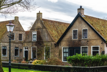 Street with old Dutch commander houses in the town of Ballum on the West-Frisian island Ameland, Netherlandsのeditorial素材