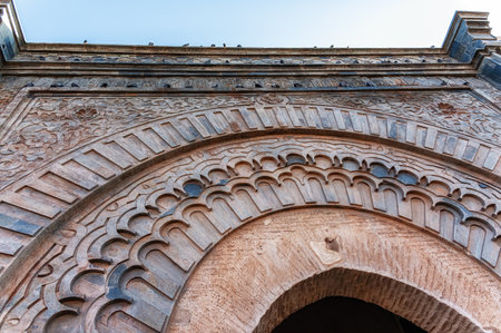 The decorative archway of Bab Agnaou. The gateway was built in the 12th century and is one of the nineteen gates of the old city of Marrakesh, a popular tourist destination in Morocco.の写真素材