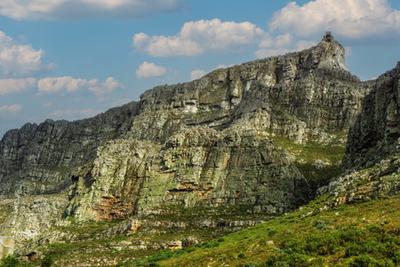 Table Mountain is a flat-topped mountain forming a prominent landmark overlooking the city of Cape Town in South Africa.の写真素材