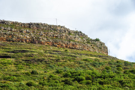 Table Mountain is a flat-topped mountain forming a prominent landmark overlooking the city of Cape Town in South Africa.の写真素材