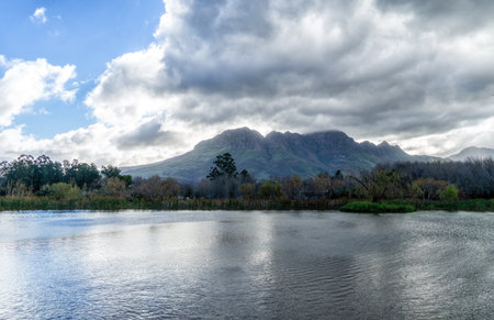 Helderberg Mountain with pond in the foreground, Somerset West, South Africaの写真素材