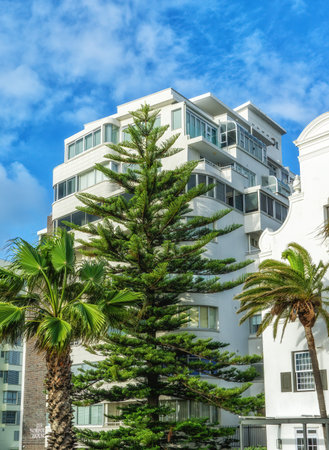 Seaside residence and boulders at Clifton Beach , an exclusive residential area and home to some of the most expensive real estate in South Africaの写真素材