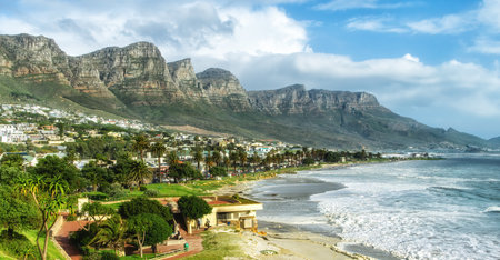 Camps Bay beach near Cape Town South Africa on a nice winter day, with the back of Table Mountain, called the twelve apostles, on the background.の写真素材