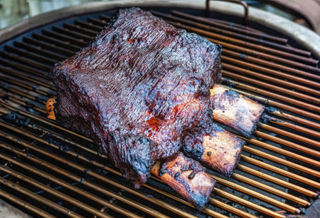Barbecue burnt chuck beef ribs marinated and sliced with hot chili sauce as top viewの写真素材