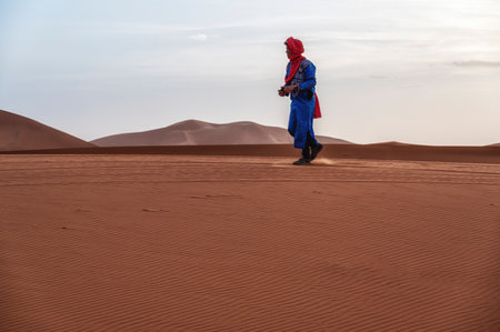 Berber in traditional dress in the Sahara desert. Erg Chebbi, Merzouga, Moroccoのeditorial素材