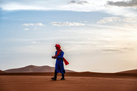 Berber in traditional dress in the Sahara desert. Erg Chebbi, Merzouga, Moroccoのeditorial素材