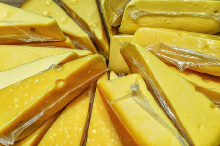Yellow Dutch cheese displayed for sale in the Netherlandsの写真素材