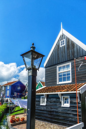 Typical Dutch village scene with wooden houses on the island of Marken in the Netherlands, Hollandの写真素材