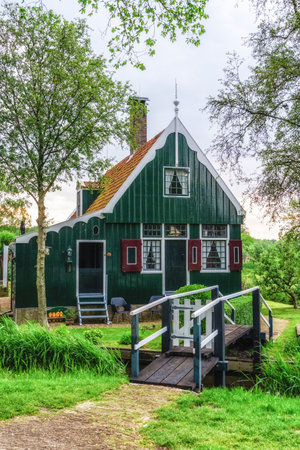 Traditional dutch houses on street in historic village Zaanse Schans, Zaandam, the Netherlandsの写真素材