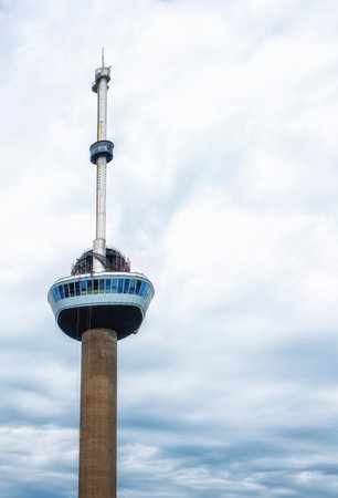 The World Famous Euromast Tower in Rotterdam Behind Cityscape With Spring Blooming Trees in The Netherlands.Vertical Compositionの写真素材