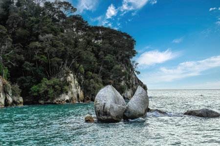 The Moeraki Boulders are unusually large spherical boulders lying along a stretch of Koekohe Beach on the wave-cut Otago coast of New Zealand between Moeraki and Hampden.の写真素材