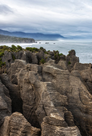 Pancake Rock is a natural wonder of New Zealand. Incredible journey to the ends of the world. Stone flat "pancakes", stacked on top of each other.の写真素材