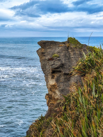Weirdly shaped exotic coastal cliffs with ocean in background, New Zealandの写真素材