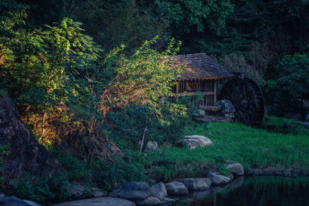 An old traditional watermill on a pond at the , Seoul, South Koreaの写真素材
